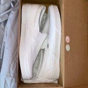 white VANS slip on shoes